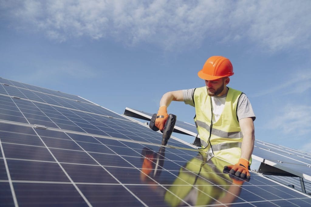 Man installing solar on the roof